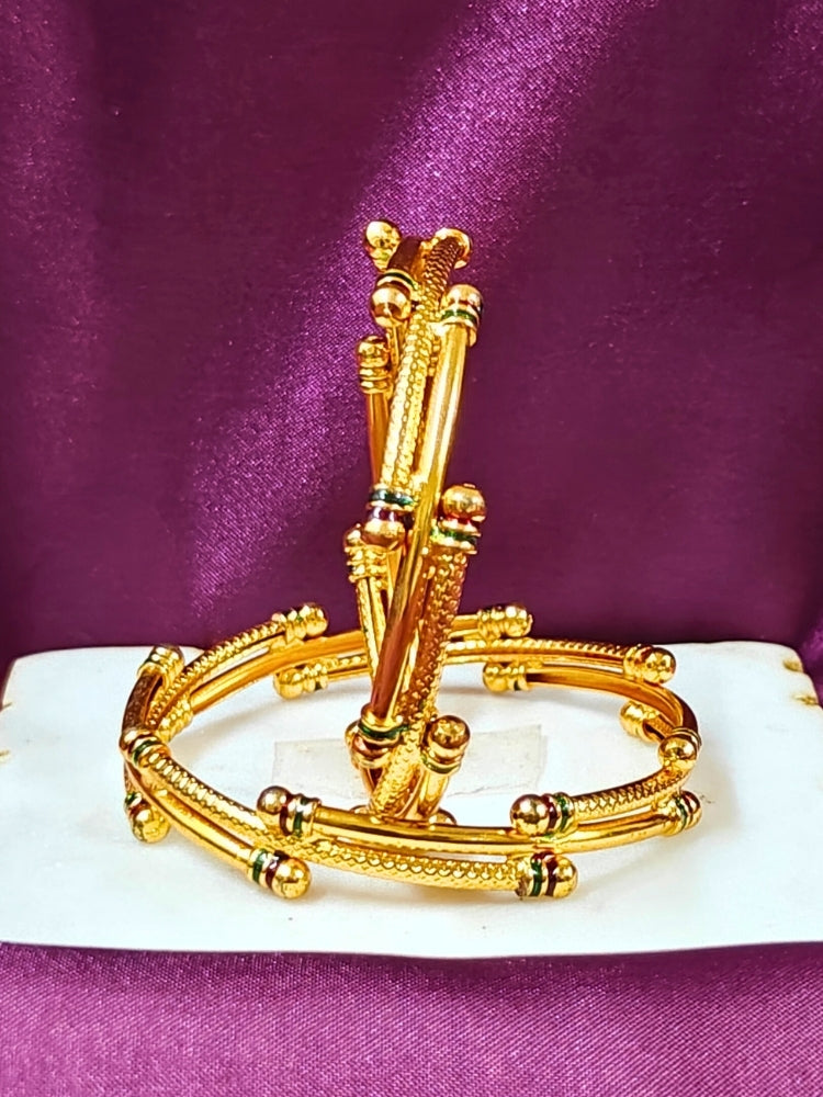Close-up of an ornate traditional (Gold Polish) White Bangles Set. It’s comfortable and lightweight enough for everyday wear, and it also looks absolutely beautiful and elegant. The design is stylish, the finish is impressive, and it feels really pleasant to wear all day.
