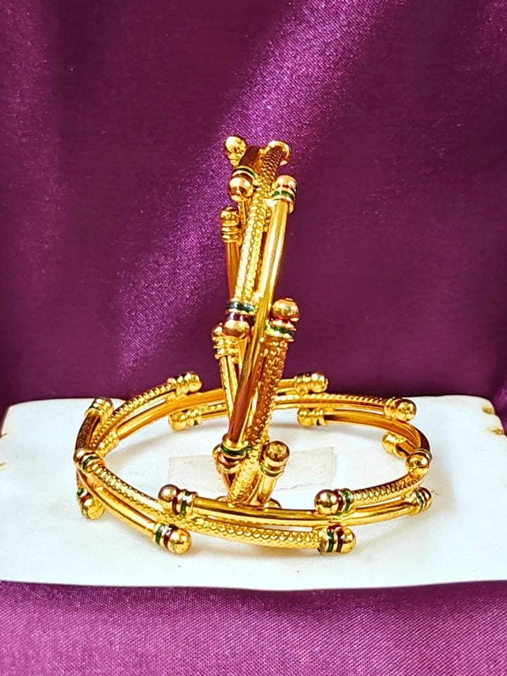 Close-up of an ornate traditional (Gold Polish) White Bangles Set. It’s comfortable and lightweight enough for everyday wear, and it also looks absolutely beautiful and elegant. The design is stylish, the finish is impressive, and it feels really pleasant to wear all day.