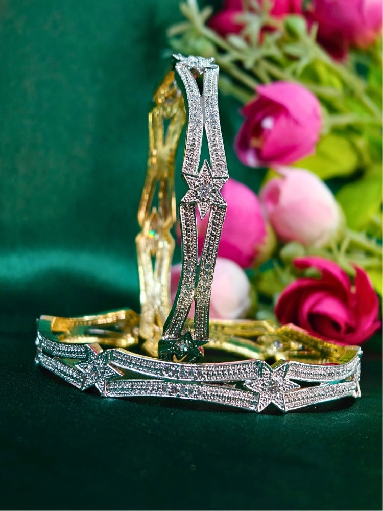 Close-up of an ornate Indo-Western (Gold Polish) Silver Diamond Bangles set with American Diamond. A stacking artificial American Diamond bangles for a festive Diwali celebration. Bridal mehendi outfit styled with luxury artificial American Diamond bangles.
