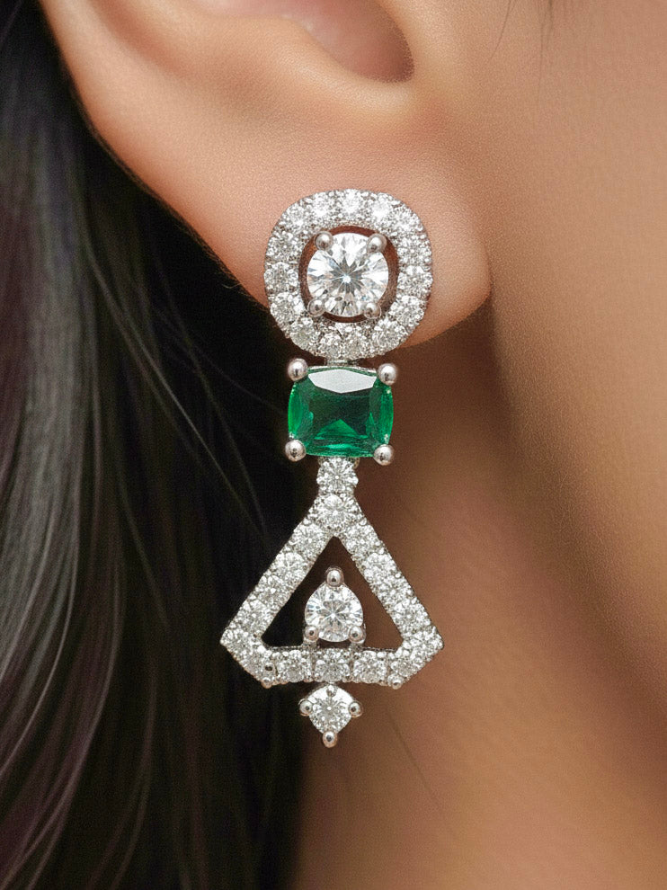 Close-up of a woman wearing an ornate Western Green (Silver Polish) Collar Diamond jewellery set and earrings with American Diamond and Green Colored Stones. Reception-ready look featuring a statement American diamond jewelry set.
Party wear outfit completed with a lightweight American diamond necklace.