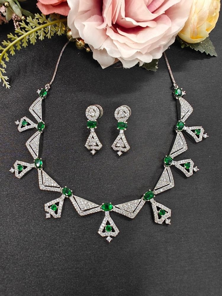 Close-up of a model in luxurious artificial diamond jewelry featuring a designer diamond necklace with green colored stone and earrings set, crafted for bridal fashion and high-end weddings. This beautiful diamond jewelry set offers the brilliance of real diamonds at an affordable price.
