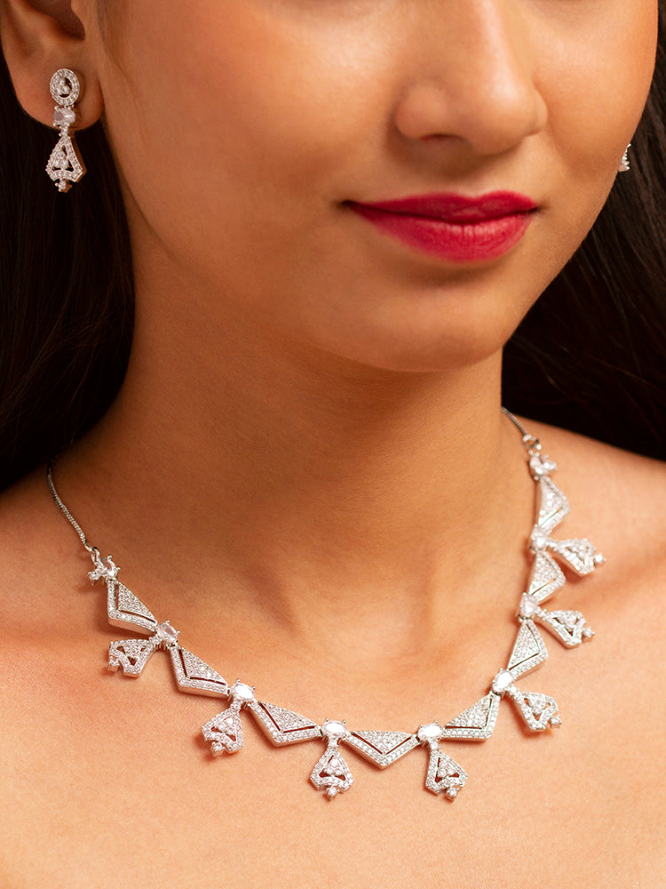 Elegant woman wearing a luxurious artificial diamond necklace with matching earrings, perfect for high-profile wedding receptions and formal galas. This high-end artificial diamond jewelry set combines style, elegance, and affordability for special occasions.