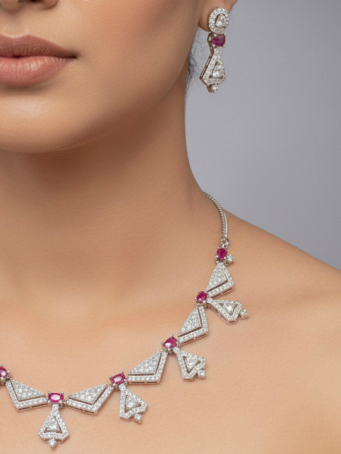 A woman showcasing a beautiful artificial diamond necklace with red colored stone and earrings set, ideal for festivals, family gatherings, and special celebrations in India. This elegant diamond jewelry provides the perfect blend of sparkle and tradition, with a modern twist.