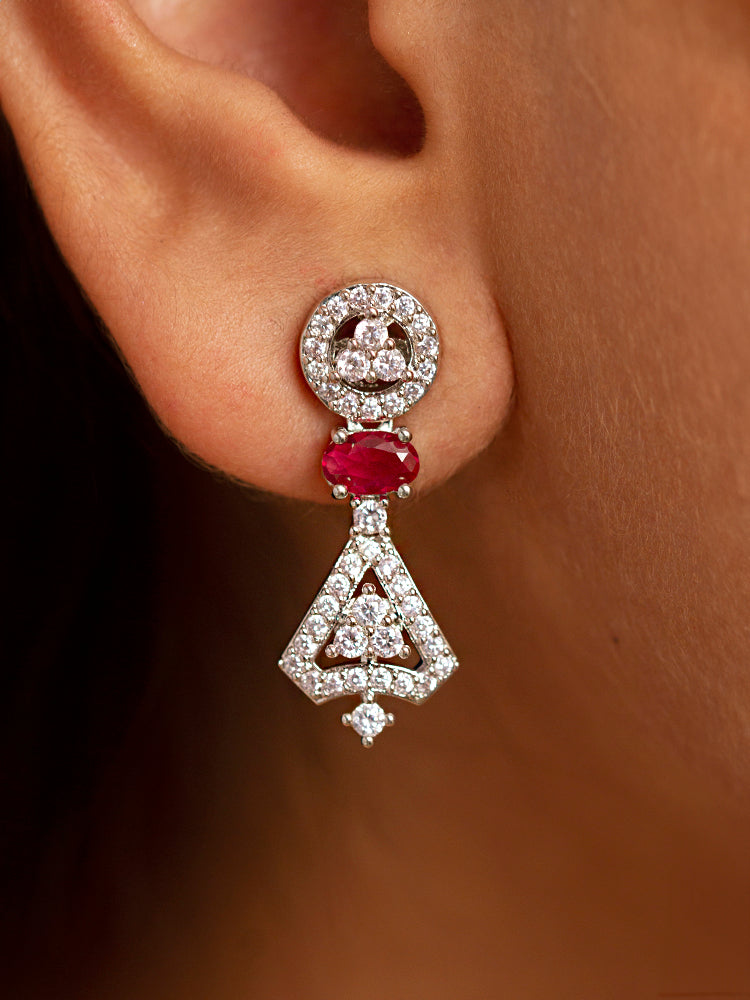 Close-up of a woman wearing a sparkling artificial diamond necklace with red colored stone and diamond earrings set, designed to offer a radiant, elegant look for any formal occasion or Indian wedding. This affordable diamond jewelry provides a flawless, luxurious alternative to natural diamonds.