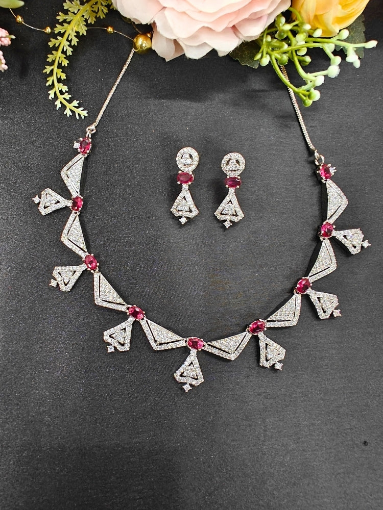 A woman showcasing a beautiful artificial diamond necklace with red colored stone and earrings set, ideal for festivals, family gatherings, and special celebrations in India. This elegant diamond jewelry provides the perfect blend of sparkle and tradition, with a modern twist.