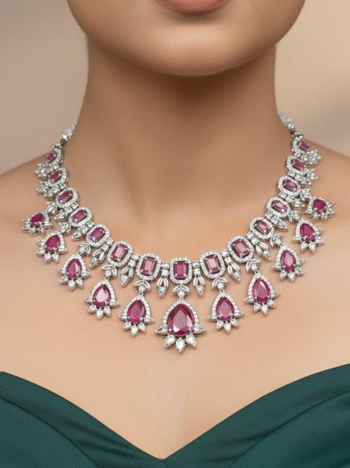 "A bride-to-be wearing an exquisite artificial diamond and pink colored stone necklace and matching earrings, designed for the perfect engagement look. This stunning artificial diamond jewelry set offers luxury and sophistication while being an affordable alternative to natural diamonds."