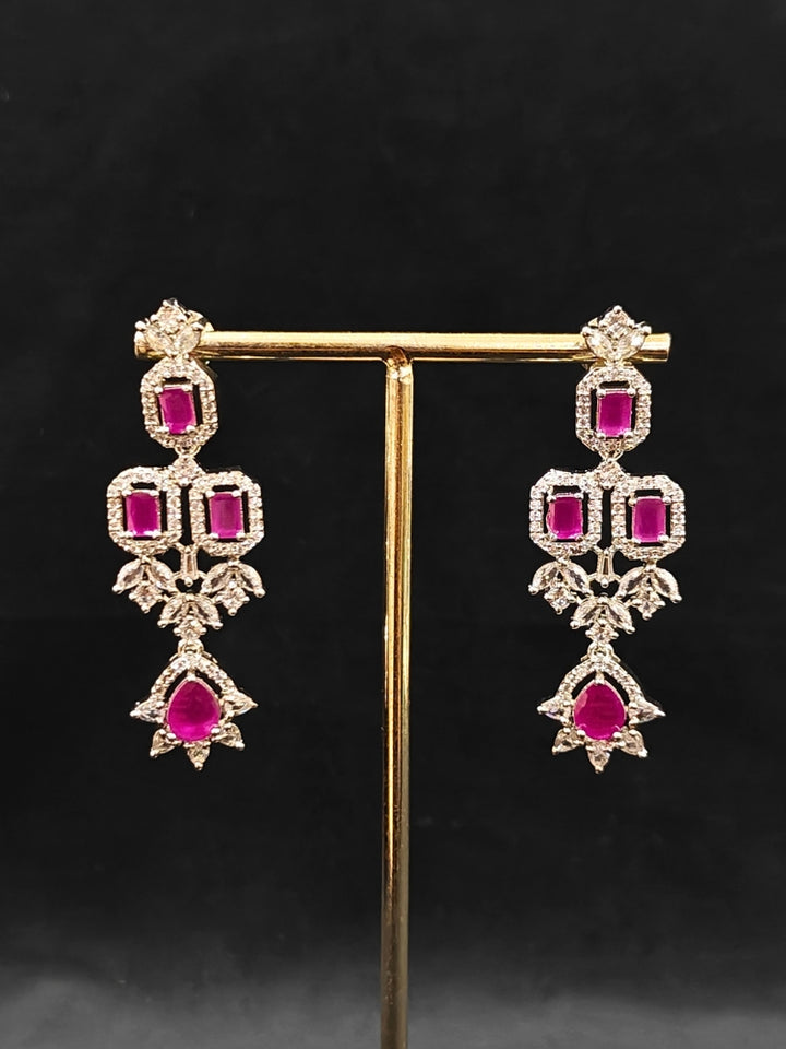 An elegant artificial diamond and pink colored stone necklace and matching earrings. This premium artificial diamond jewelry set is perfect for special occasions, from Indian weddings to engagement parties, offering sophisticated glamour without the high price tag.