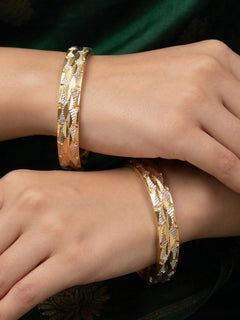 Close-up of an a women wearing ornate traditional (Gold Polish) Bangles Set. It’s comfortable and lightweight enough for everyday wear, and it also looks absolutely beautiful and elegant. The design is stylish, the finish is impressive, and it feels really pleasant to wear all day.