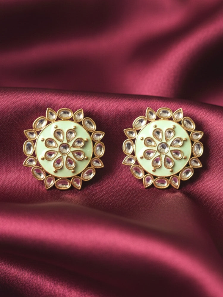 Close-up of an ornate traditional Mint Green Meenakari Studs Earrings with Kundan, Enamel and Meenakari.  Lightweight artificial Meenakari Studs earrings for mehendi ceremony. Wearing trendy Meenakari artificial Studs earrings for a 2026 Festive celebration in India.