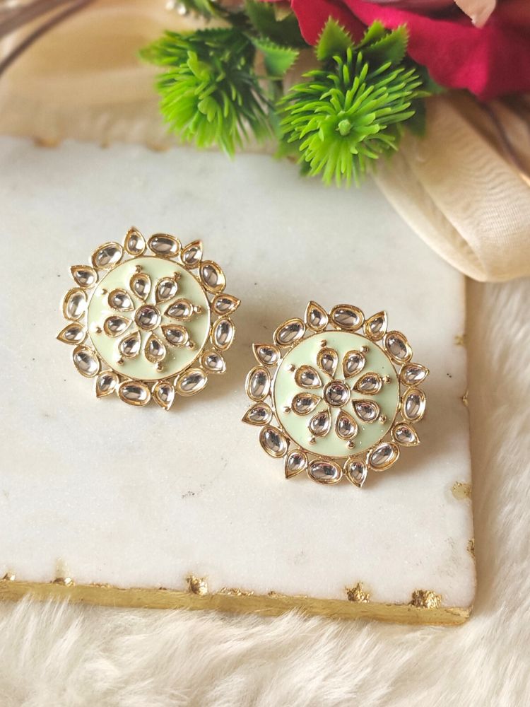 Close-up of an ornate traditional Mint Green Meenakari Studs Earrings with Kundan, Enamel and Meenakari.  Lightweight artificial Meenakari Studs earrings for mehendi ceremony. Wearing trendy Meenakari artificial Studs earrings for a 2026 Festive celebration in India.