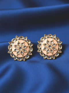 Close-up of an ornate traditional Peach Kundan Studs Earrings with Kundan, Enamel and Meenakari.  Lightweight artificial Kundan Studs earrings for Wedding ceremony. Wearing trendy artificial Kundan Studs earrings for a 2026 Festive celebration in India.