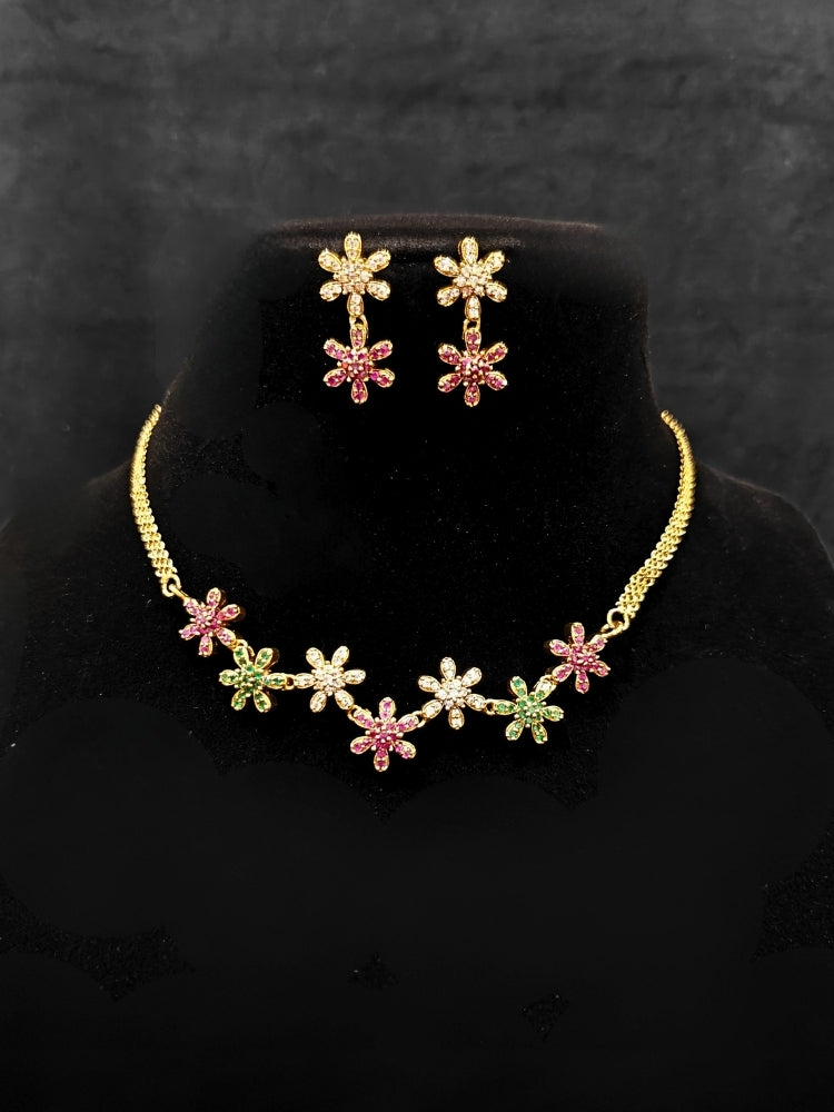 Close-up of an ornate Indo-western (Mehendi Gold Antique Finish Polish) Choker jewellery set and earrings American Diamond and Colored Stones. A lightweight American diamond necklace perfect for long wedding functions. Close-up of  featuring an anti-tarnish American diamond artificial necklace.