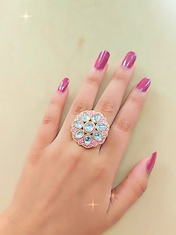 Close-up of a woman wearing an ornate traditional Pink Meenakari gold Ring with Tyaani Kundan and Meenakari. Saree styling inspiration with a Meenakari Ring. Festive celebration look enhanced with traditional Meenakari Ring.
