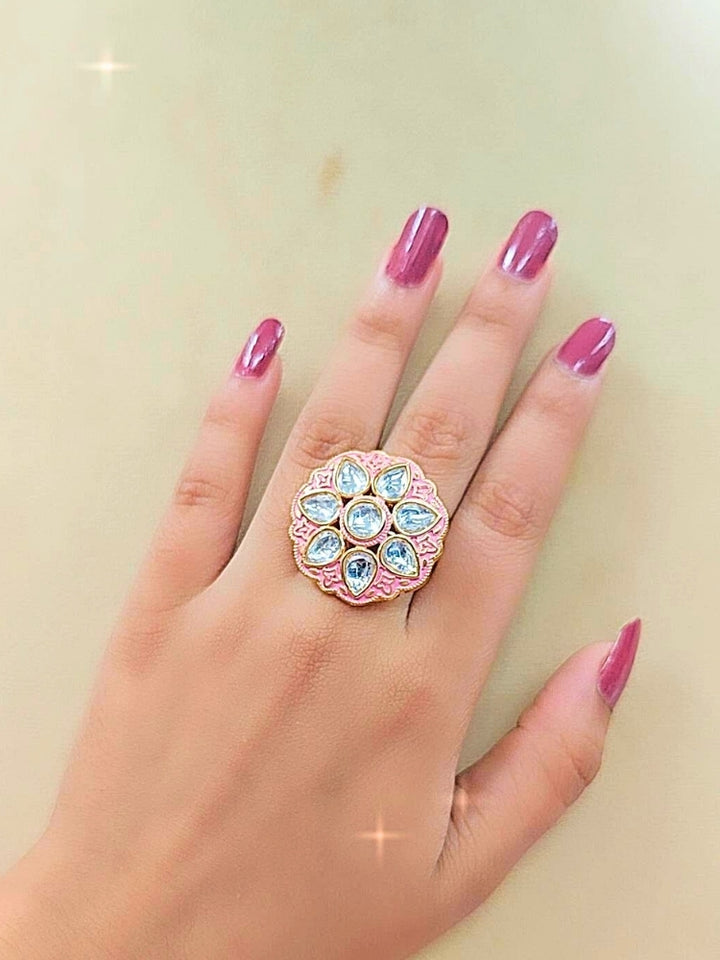 Close-up of a women wearing an ornate traditional Pink Kundan gold Ring with Tyaani Kundan and Kundan. Saree styling inspiration with a Kundan Ring. Festive celebration look enhanced with traditional Meenakari Ring.