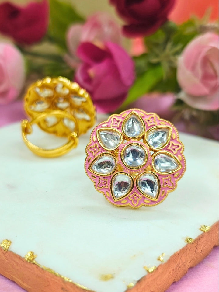Close-up of an ornate traditional Pink Kundan gold Ring with Tyaani Kundan and Kundan. Saree styling inspiration with a Kundan Ring. Festive celebration look enhanced with traditional Meenakari Ring.