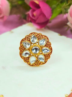 Close-up of an ornate traditional Red Kundan gold Ring with Tyaani Kundan and Kundan. Saree styling inspiration with a Kundan Ring. Festive celebration look enhanced with traditional Meenakari Ring.