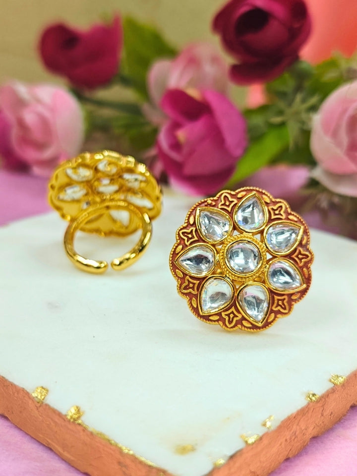 Close-up of an ornate traditional Red Kundan gold Ring with Tyaani Kundan and Kundan. Saree styling inspiration with a Kundan Ring. Festive celebration look enhanced with traditional Meenakari Ring.