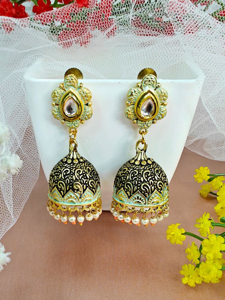 Close-up of an ornate traditional Mint Green Meenakari gold Earrings with Pearls, Kundan and Meenakari. Festive Diwali look styled with premium artificial Meenakari earrings. Festive saree look completed with premium imitation Meenakari earrings.
