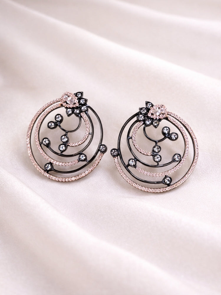 Close-up of an ornate Western Black & Pink Diamond Studs Earrings with American Diamonds. Elegant party wear styled with high-quality imitation American Diamond Studs earrings. Close-up of sparkling American diamond Studs earrings for party wear.