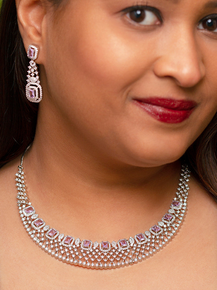 Close-up of a woman wearing a stunning affordable artificial diamond necklace and matching earrings set, perfect for wedding guests and formal events. This luxury artificial diamond jewelry provides the brilliance of real diamonds at a fraction of the cost.