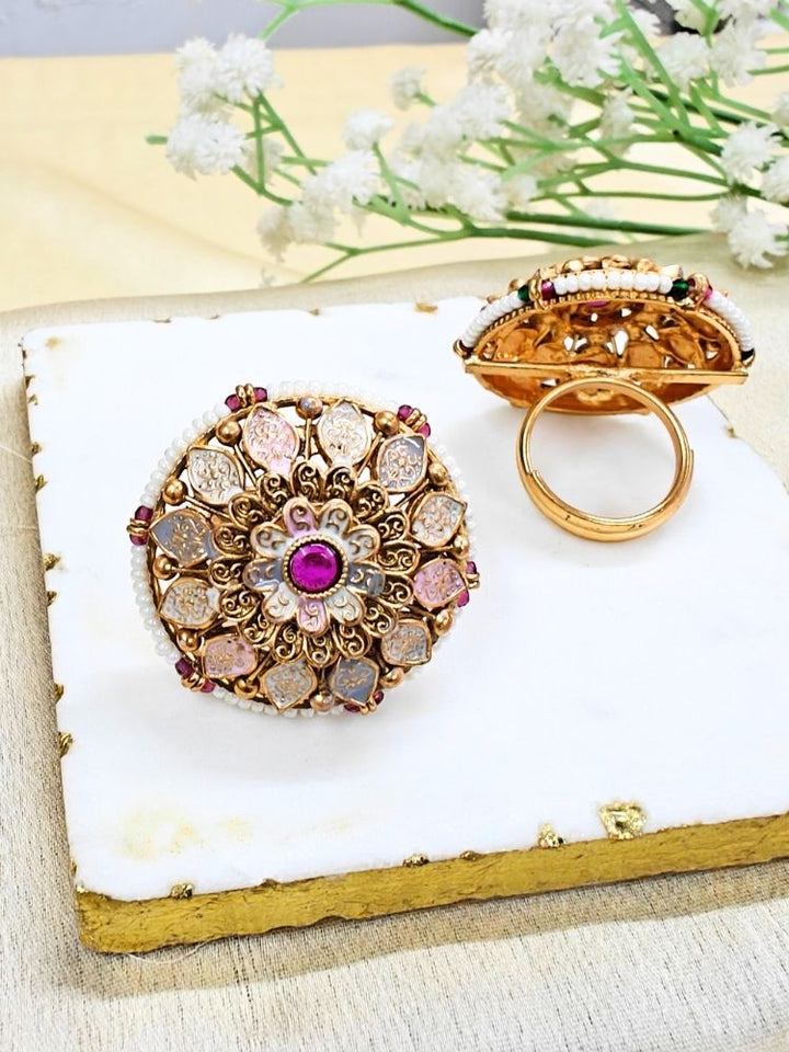 Close-up of an ornate traditional Multi-Color Meenakari gold Ring with Pearls, Colored Stone and Meenakari. A trendy artificial Meenakari ring for wedding season in India. Close-up of a high-quality imitation Meenakari ring with intricate detailing.