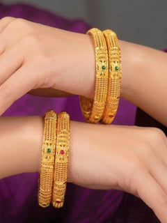 Close-up of an a women wearing ornate traditional (Gold Polish) Bangles Set. It’s comfortable and lightweight enough for everyday wear, and it also looks absolutely beautiful and elegant. The design is stylish, the finish is impressive, and it feels really pleasant to wear all day.