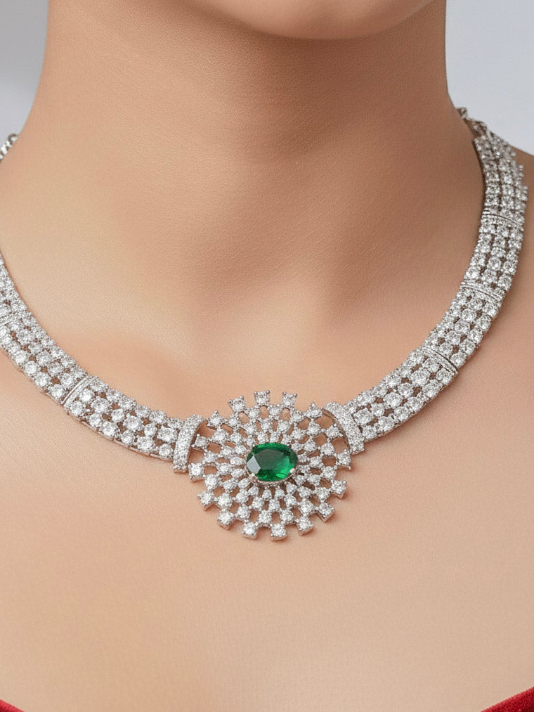 Close-up of a woman wearing a stunning affordable artificial diamond necklace with emerald green colored stone and matching earrings set, perfect for wedding guests and formal events. This luxury artificial diamond jewelry provides the brilliance of real diamonds at a fraction of the cost.