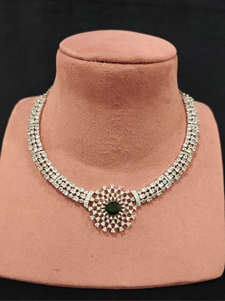 A beautiful artificial diamond necklace with emerald green colored stone and earrings set, ideal for festivals, family gatherings, and special celebrations in India. This elegant diamond jewelry provides the perfect blend of sparkle and tradition, with a modern twist.