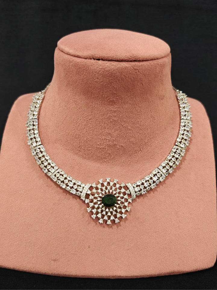 A beautiful artificial diamond necklace with emerald green colored stone and earrings set, ideal for festivals, family gatherings, and special celebrations in India. This elegant diamond jewelry provides the perfect blend of sparkle and tradition, with a modern twist.