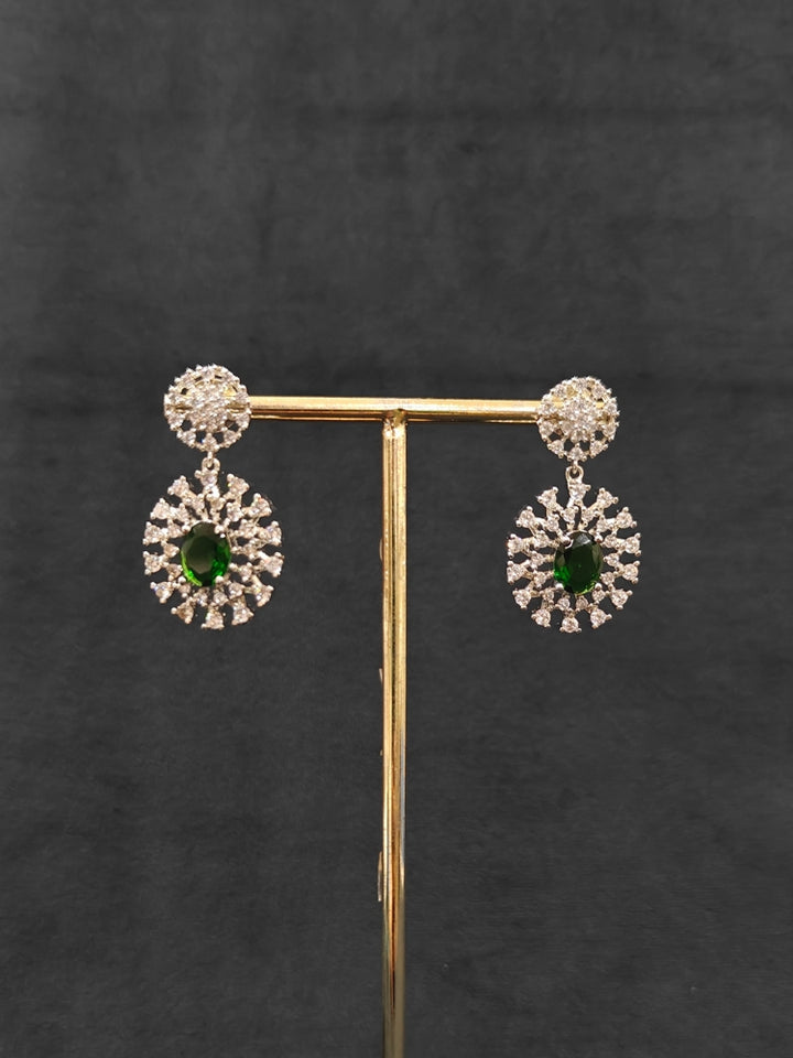 A beautiful artificial diamond necklace with emerald green colored stone and earrings set, ideal for festivals, family gatherings, and special celebrations in India. This elegant diamond jewelry provides the perfect blend of sparkle and tradition, with a modern twist.