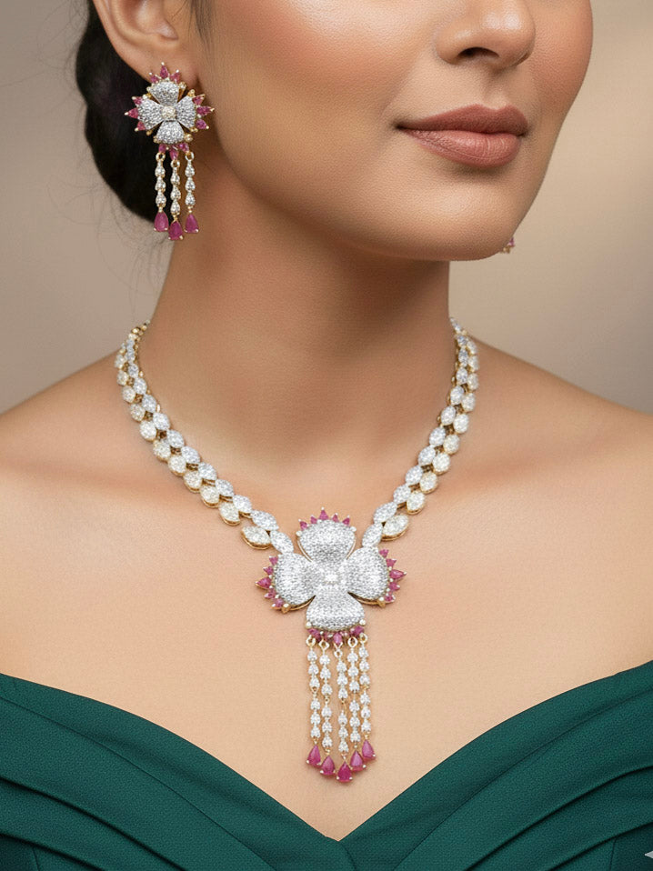 "Close-up of a woman wearing a sparkling artificial diamond necklace with pink colored stone and diamond earrings and diamond maangtikka set, designed to offer a radiant, elegant look for any formal occasion or Indian wedding. This affordable diamond jewelry provides a flawless, luxurious alternative to natural diamonds."

