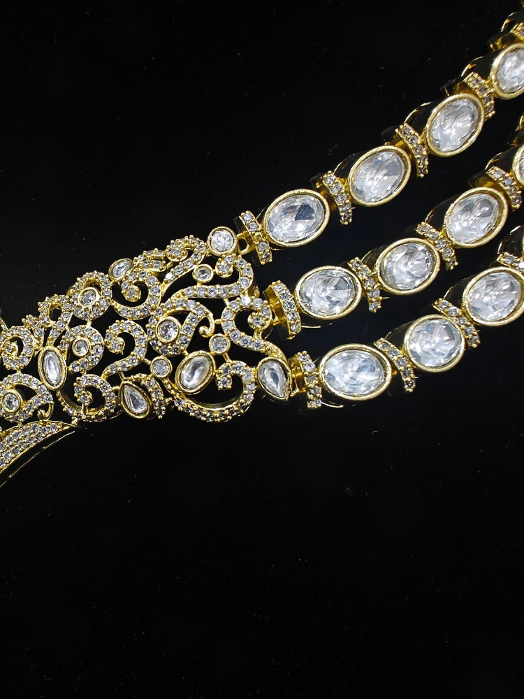 A glamorous artificial diamond and green colored stone and kudan polki necklace paired with chic earrings, perfect for bridal wear. This high-quality artificial diamond jewelry set is the ideal choice for modern brides looking for a budget-friendly option with timeless sparkle."