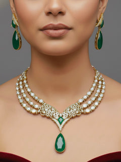 "A stunning woman wearing a glamorous artificial diamond and green colored stone and kudan polki necklace paired with chic earrings, perfect for bridal wear. This high-quality artificial diamond jewelry set is the ideal choice for modern brides looking for a budget-friendly option with timeless sparkle."