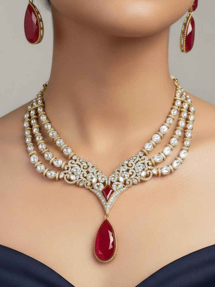 "A stunning woman wearing a glamorous artificial diamond and red colored stone, kundan polki necklace paired with chic earrings, perfect for bridal wear. This high-quality artificial diamond jewelry set is the ideal choice for modern brides looking for a budget-friendly option with timeless sparkle."