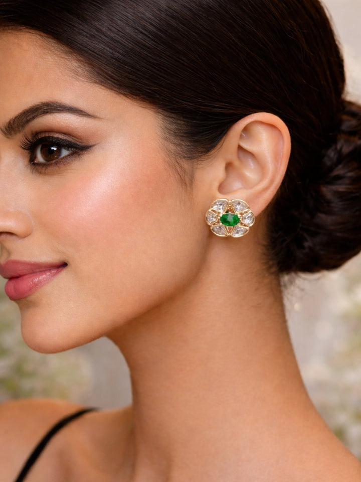 Close-up of a woman wearing an ornate Indo-Western (Rose Gold Polish) Dark Green Studs Earrings with Dark Green Colored Stone and Polki. Indo-western outfit styled with a statement Polki Studs Earrings. Perfect and comfortable for office or everyday use.