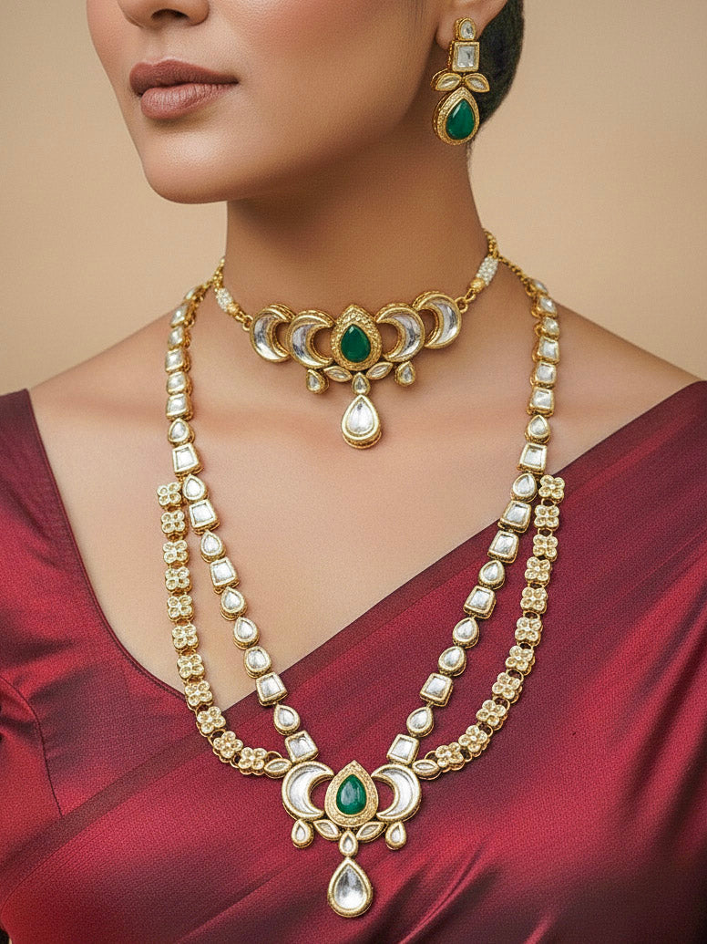 Close-up of a woman wearing an ornate traditional (Gold Polish) Dark Green Long Kundan jewellery set and earrings and a Choker and Mangtikka with Kundan and Colored Stones. Wedding celebration look enhanced with a statement Kundan necklace. Bride wearing a royal Kundan artificial necklace for wedding rituals.
