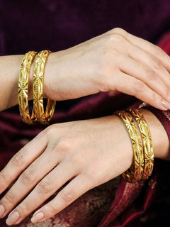 Close-up of an a women wearing ornate traditional (Gold Polish) Bangles Set. It’s comfortable and lightweight enough for everyday wear, and it also looks absolutely beautiful and elegant. The design is stylish, the finish is impressive, and it feels really pleasant to wear all day.