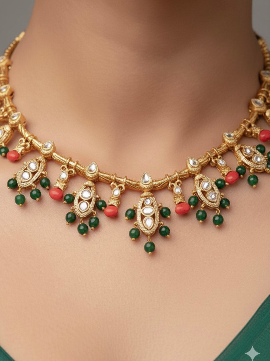 Close-up of a woman wearing an ornate traditional (Gold Polish) Collar jewellery set and earrings with Colored Stone, Beads and American Diamonds. Festive Diwali outfit paired with a colorful Colored Stone necklace. Mehendi ceremony look completed with a Colored Stone  jewelry set.