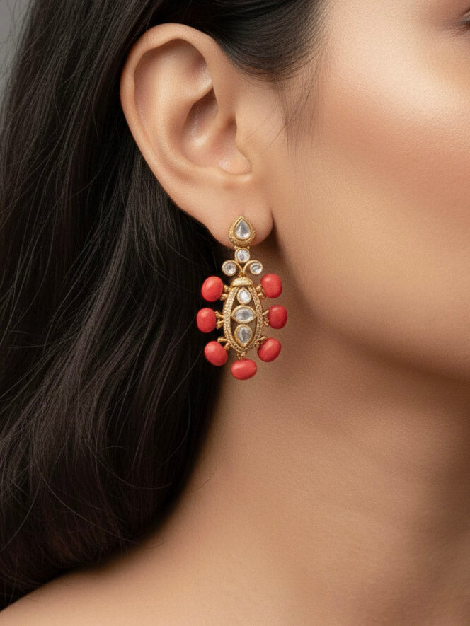 Close-up of a woman wearing an ornate traditional (Gold Polish) Collar jewellery set and earrings with Colored Stone, Beads and American Diamonds. Festive Diwali outfit paired with a colorful Colored Stone necklace. Mehendi ceremony look completed with a Colored Stone  jewelry set.