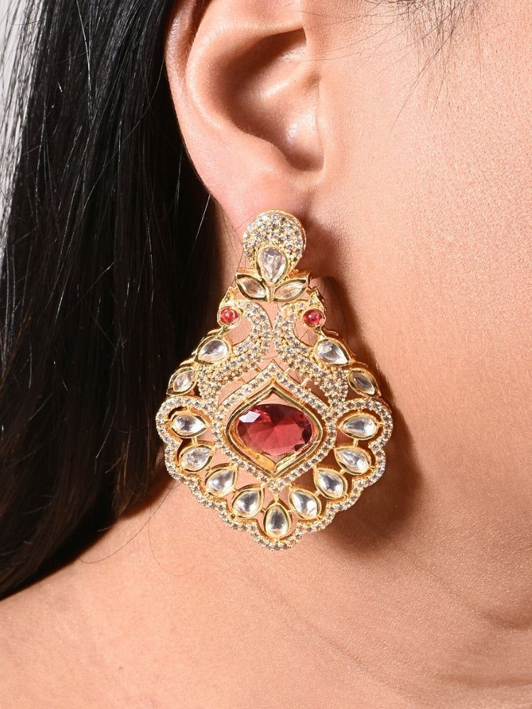 Close-up of a woman wearing an ornate traditional Red (gold Polish) Diamond  Earrings with American Diamond, Kundan and Colored Stones. Elegant festive look with a high-quality imitation American diamond Earrings. A graceful woman wearing a trending American diamond necklace for a 2026 wedding celebration.