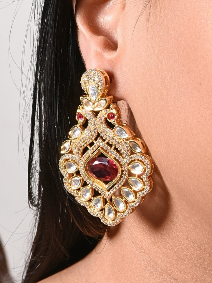 Close-up of a woman wearing an ornate traditional Red (gold Polish) Diamond  Earrings with American Diamond, Kundan and Colored Stones. Elegant festive look with a high-quality imitation American diamond Earrings. A graceful woman wearing a trending American diamond necklace for a 2026 wedding celebration.