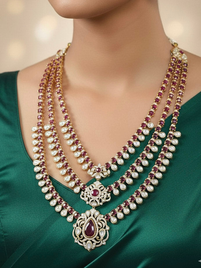 Close-up of a woman wearing an ornate traditional Red Heritage gold Long Layered jewellery set and earrings with colored Stone, Kundan and American Diamond. Mehendi ceremony styling featuring a premium heritage artificial jewelry piece. Traditional Indian look completed with a heritage artificial jewelry set.