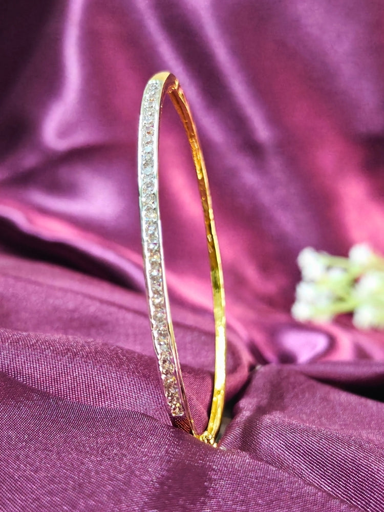 Close-up of a woman wearing an ornate Western (Gold & Silver Polish) Bracelet with American Diamond. Festive outfit paired with a premium imitation American Diamond bracelet in India. Close-up of skin-friendly artificial jewelry American Diamond bracelet in India.