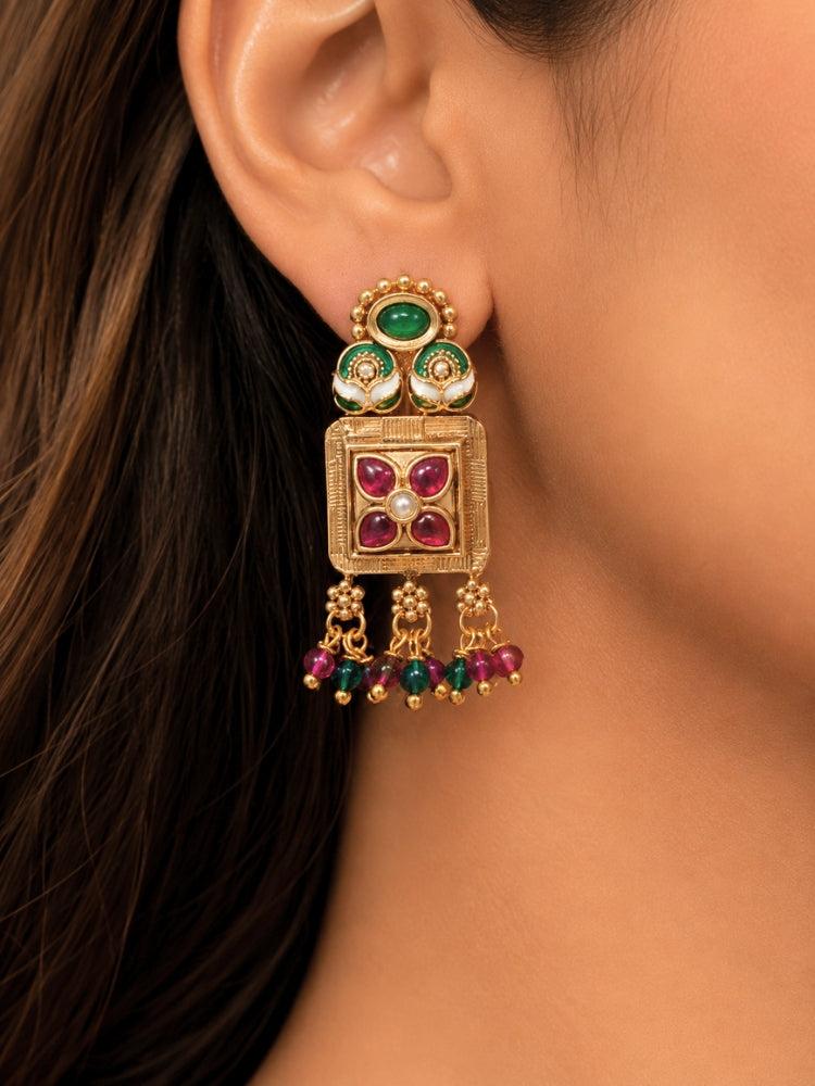Close-up of a women wearing an ornate traditional (Gold Polish) Pink & Green Long jewellery set and earrings with Pearls, Green & Pink Crystal Beads and Meenakari. Festive Diwali outfit paired with a colorful Meenakari necklace. Wedding function styling with a premium Meenakari imitation necklace.