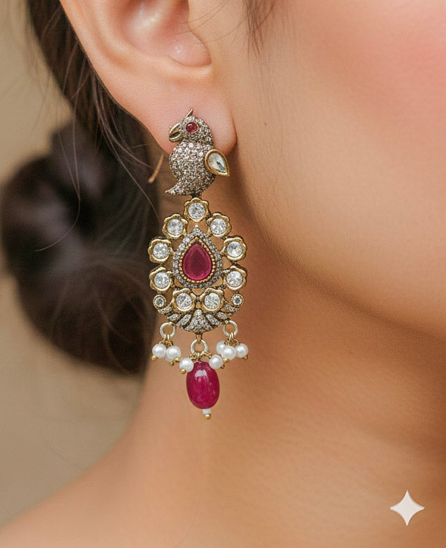 Close-up of a woman wearing an ornate traditional Ruby Red (Mehendi Polish)  Choker Diamond jewellery set and earrings with Pearls, Tumble Beads, American Diamond, Kundan and Ruby Red Colored Stones. Festive Diwali outfit styled with an American diamond artificial necklace. Close-up of high-quality  artificial American Diamond necklace craftsmanship.
