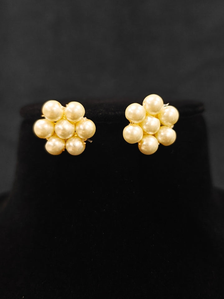 Close-up of an ornate Indo-Western White Pearl Layered Jewellery Set and Earring with Pearl. Indo-western outfit styled with a statement Pearl necklace set. Party wear outfit completed with a lightweight Pearl necklace.
