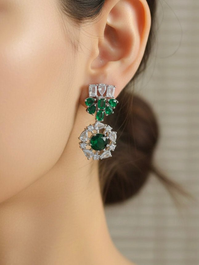 "A stunning woman wearing a glamorous artificial diamond necklace with green colored stone paired with chic earrings, perfect for bridal wear. This high-quality artificial diamond jewelry set is the ideal choice for modern brides looking for a budget-friendly option with timeless sparkle."