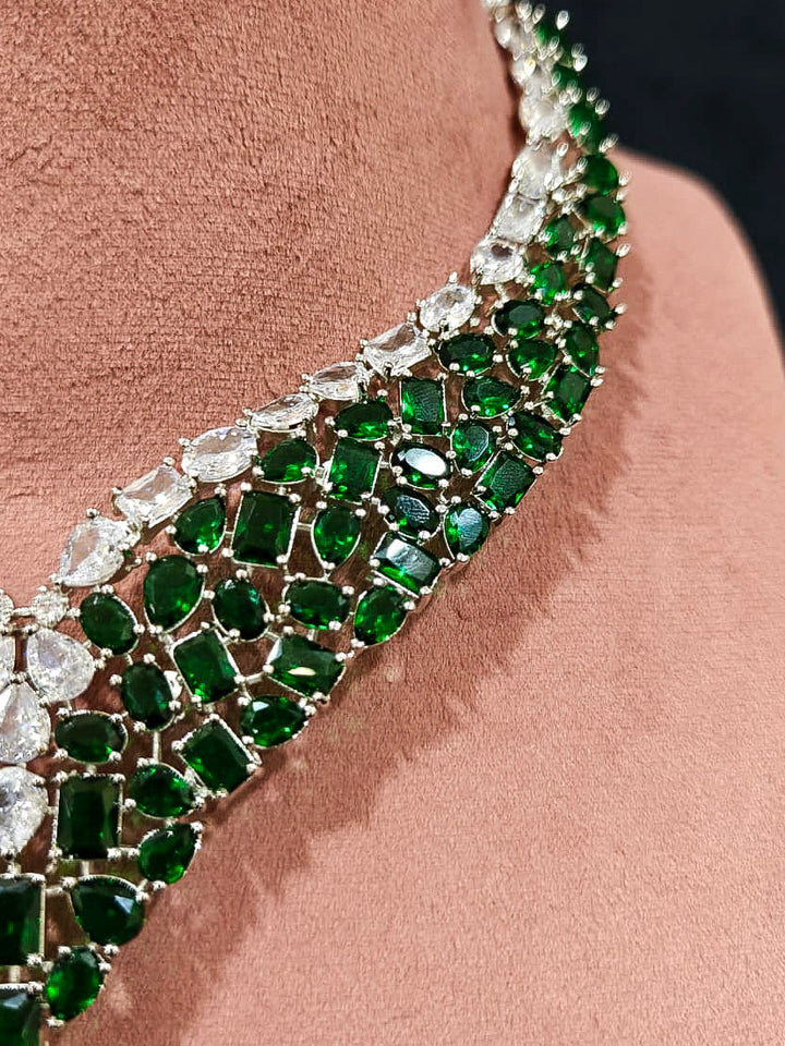 An exquisite artificial diamond necklace with green colored stone and matching earrings, designed for the perfect look. This stunning artificial diamond jewelry set offers luxury and sophistication while being an affordable alternative to natural diamonds.