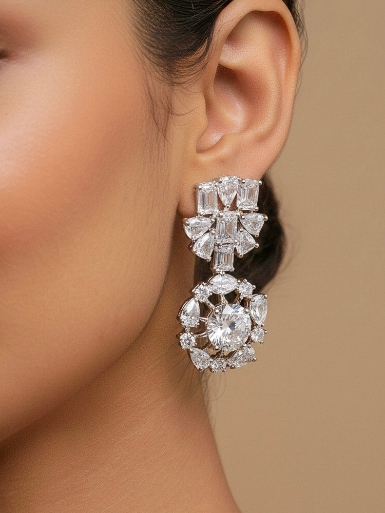 Close-up of a woman wearing an ornate Western American Diamond Silver Collar jewellery set and earrings with American Diamond. Elegant engagement jewelry look featuring a premium artificial American diamond necklace. Woman styling a statement American diamond necklace with an off-shoulder gown for a reception.