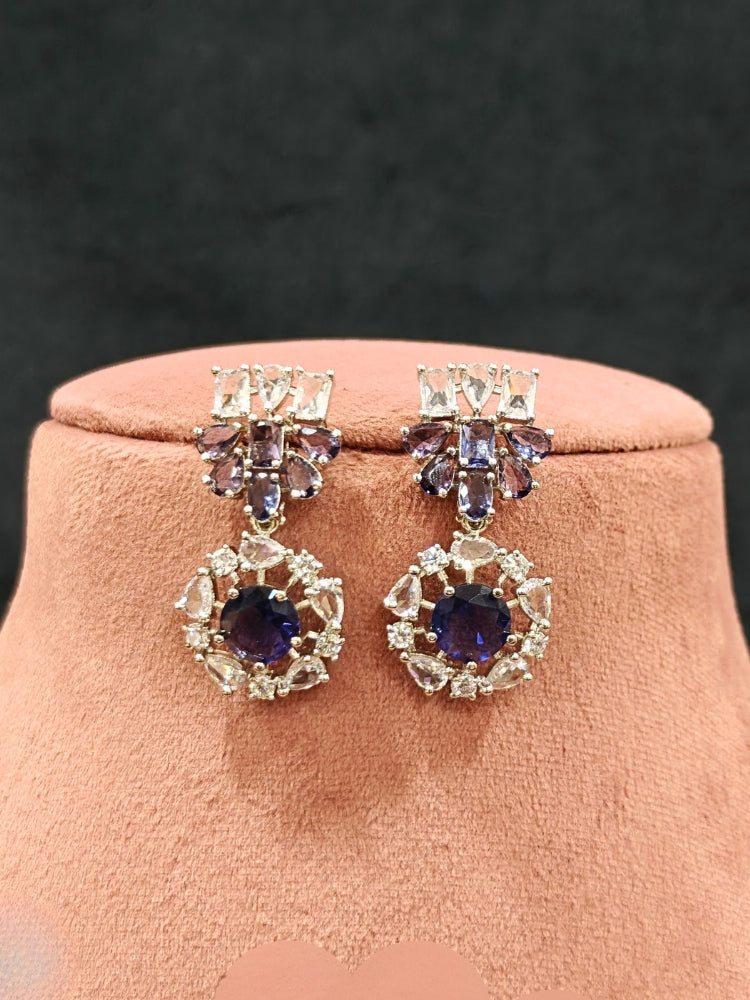 Close-up of an ornate Western Purple Colored Stones Silver Collar jewellery set and earrings with American Diamond and Colored Stones.A statement Colored Stones necklace with an off-shoulder gown for a reception and Party.
